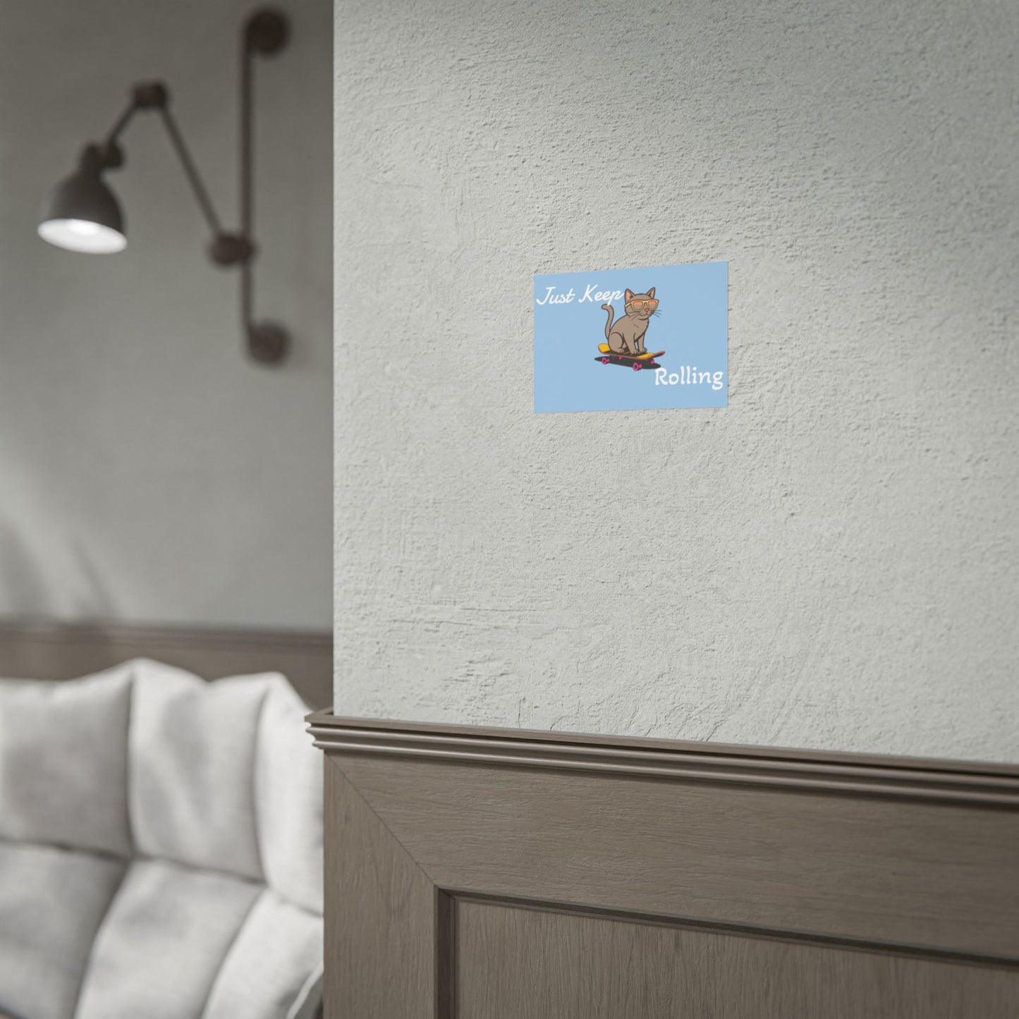 Cartoon cat on a surfboard with text on a blue square sticker attached to a textured wall.