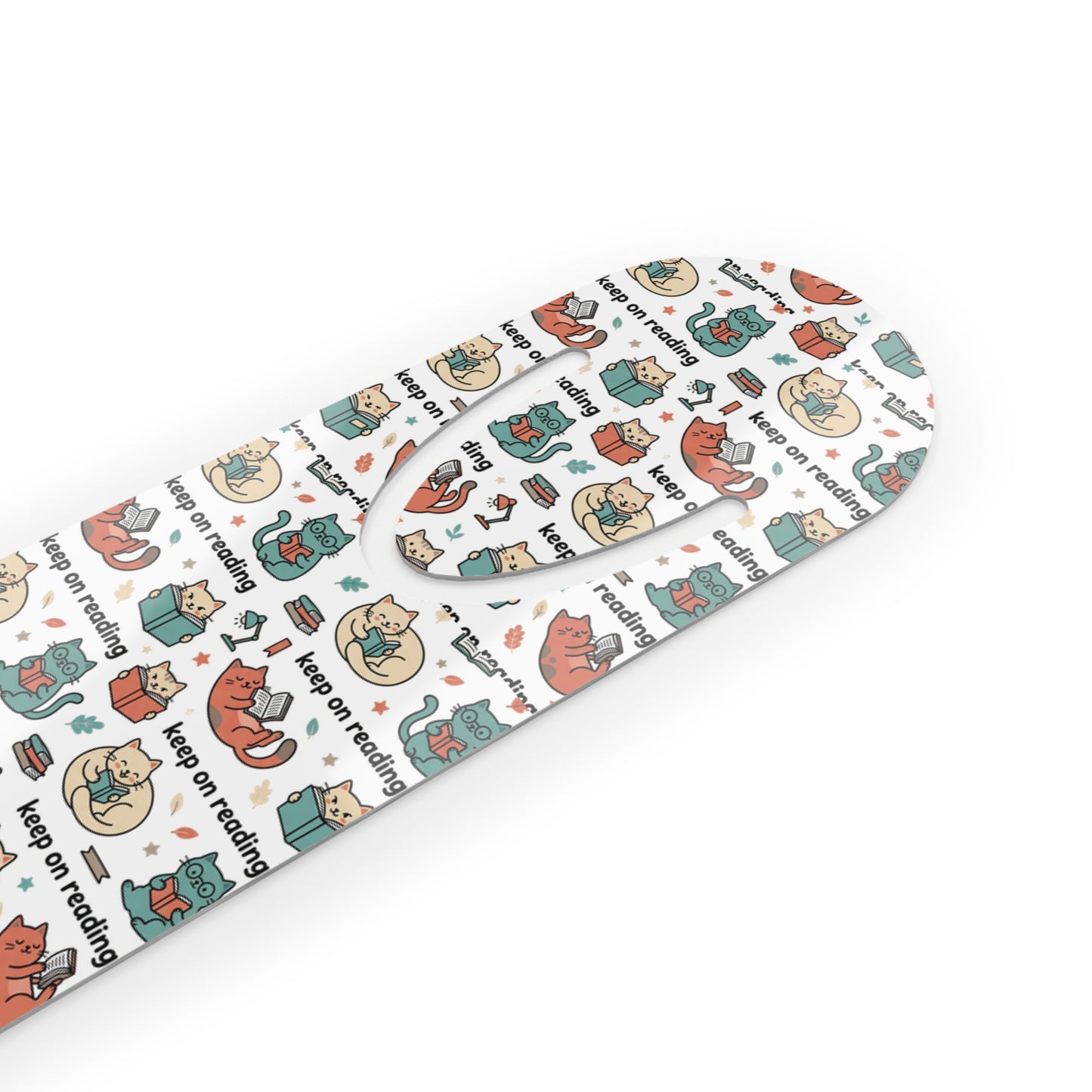 Patterned paper with cartoon cats and 'keep on reading' text on a white background