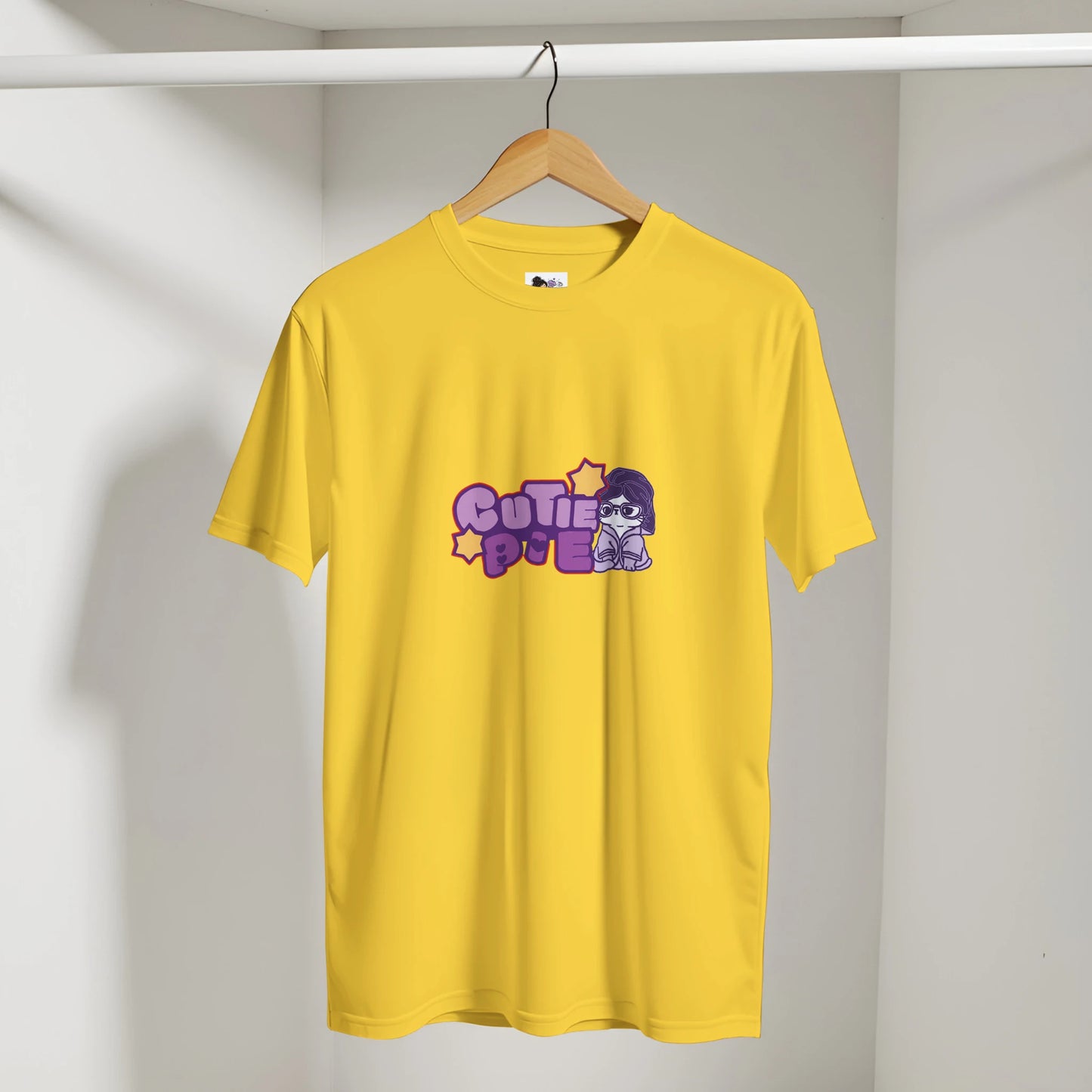Cute cat graphic t-shirt featuring the phrase "Cutie Pie" with a playful and colourful design.