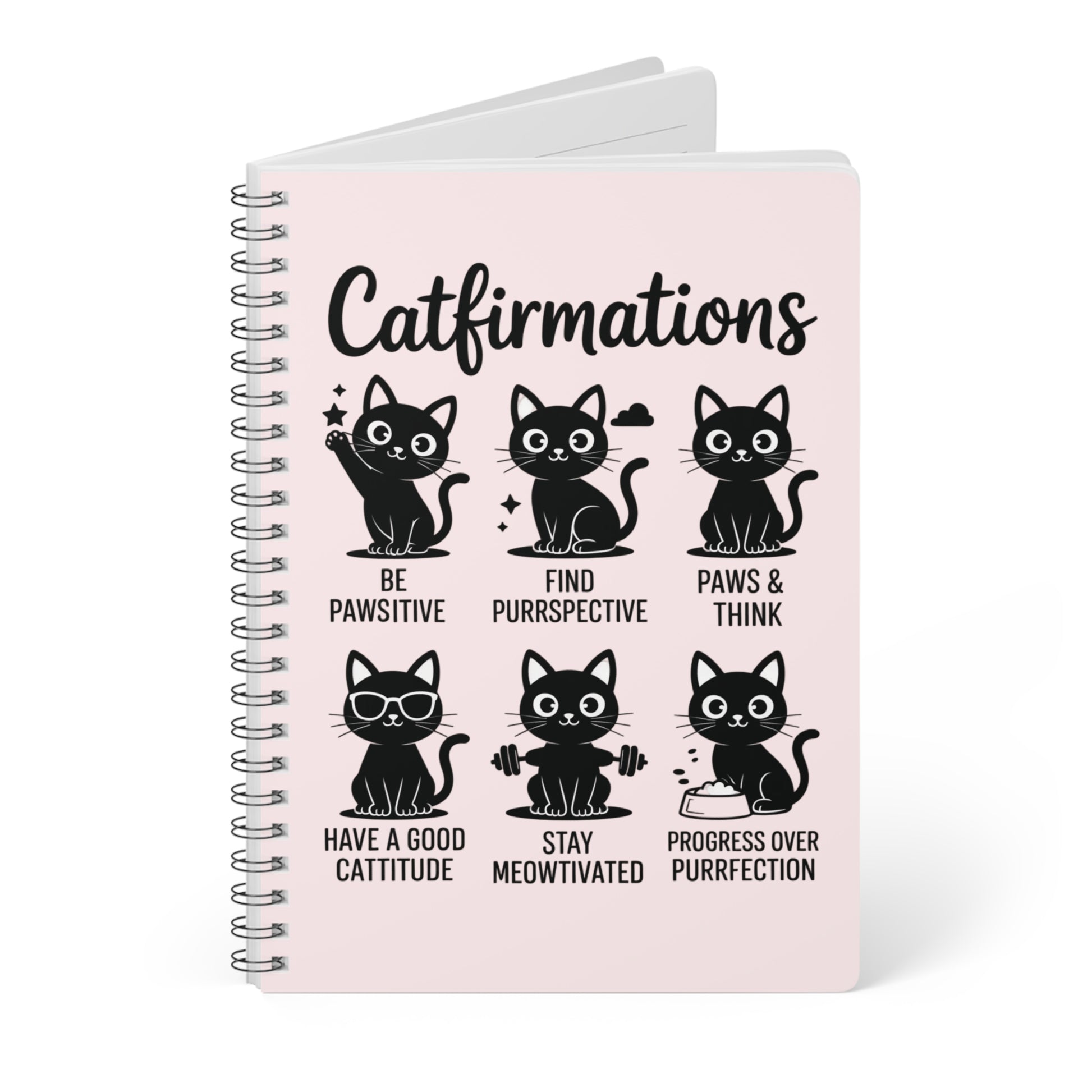 Notebook with cat-themed sayings on a pink cover