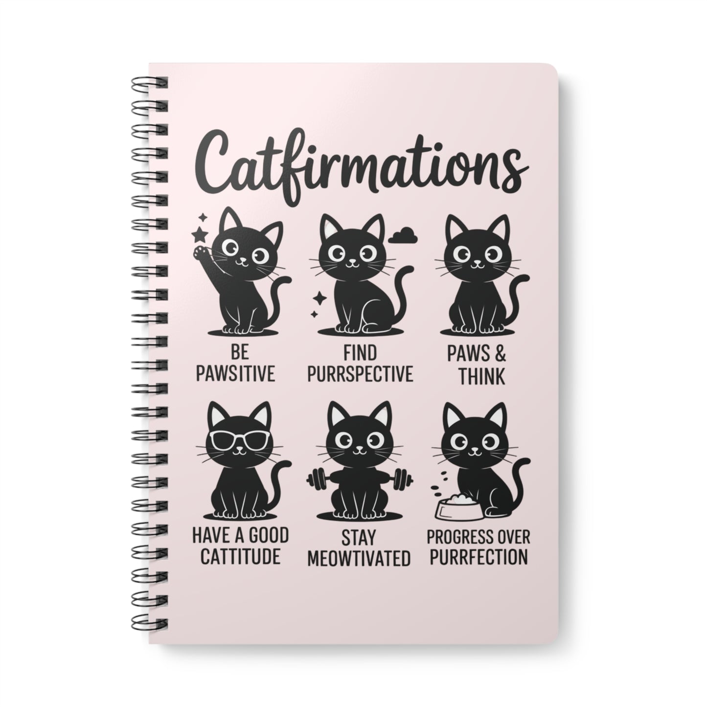 Notebook with cat-themed affirmations on a pink background