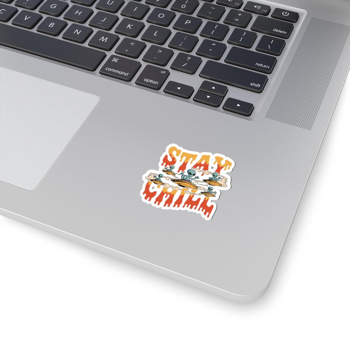 Laptop with a 'Stay Chill' sticker on the palm rest area