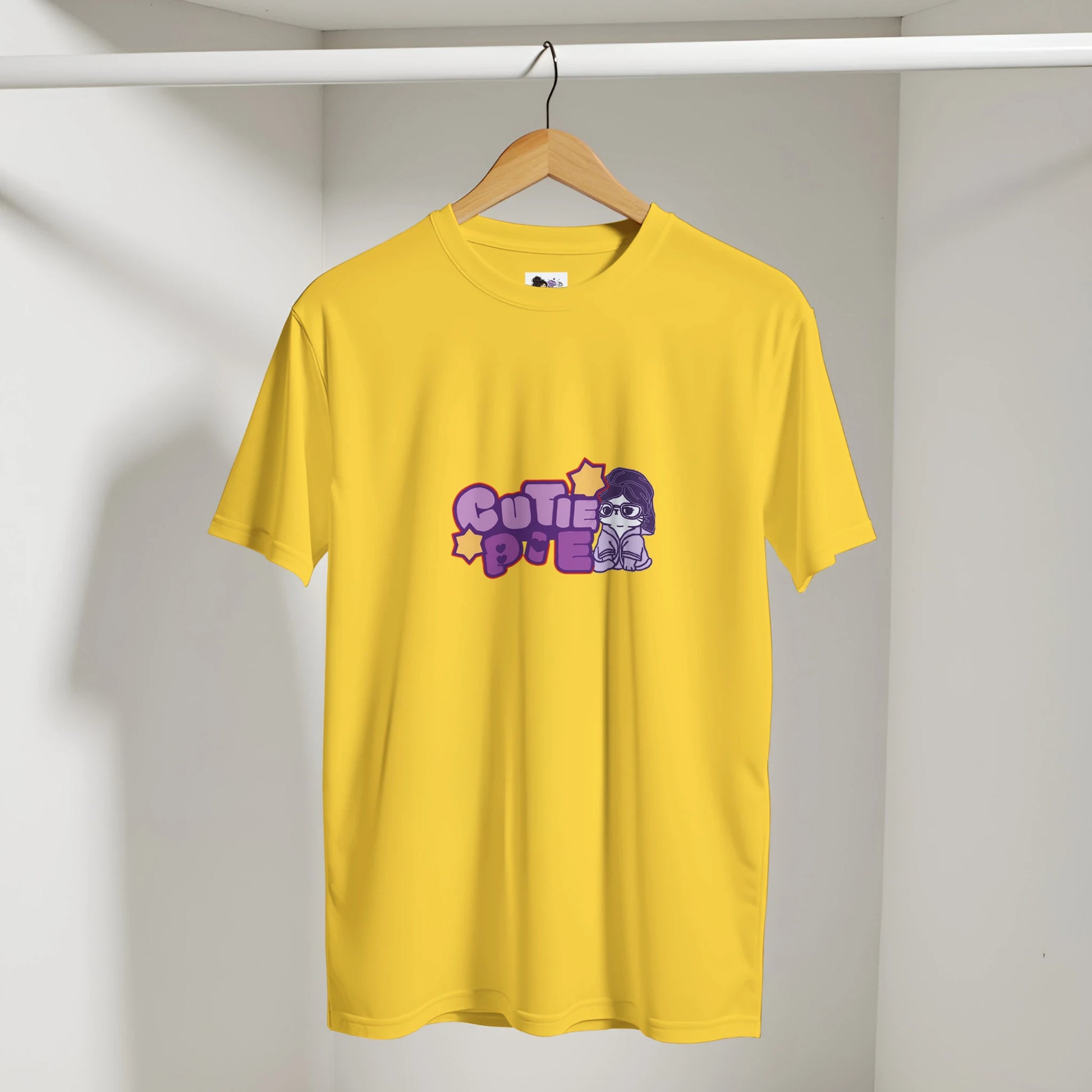 Cute cat graphic t-shirt featuring the phrase "Cutie Pie" with a playful and colourful design.