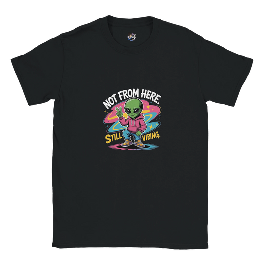Not From Here Still Vibing graphic tee featuring an alien-themed design on a casual everyday t-shirt.