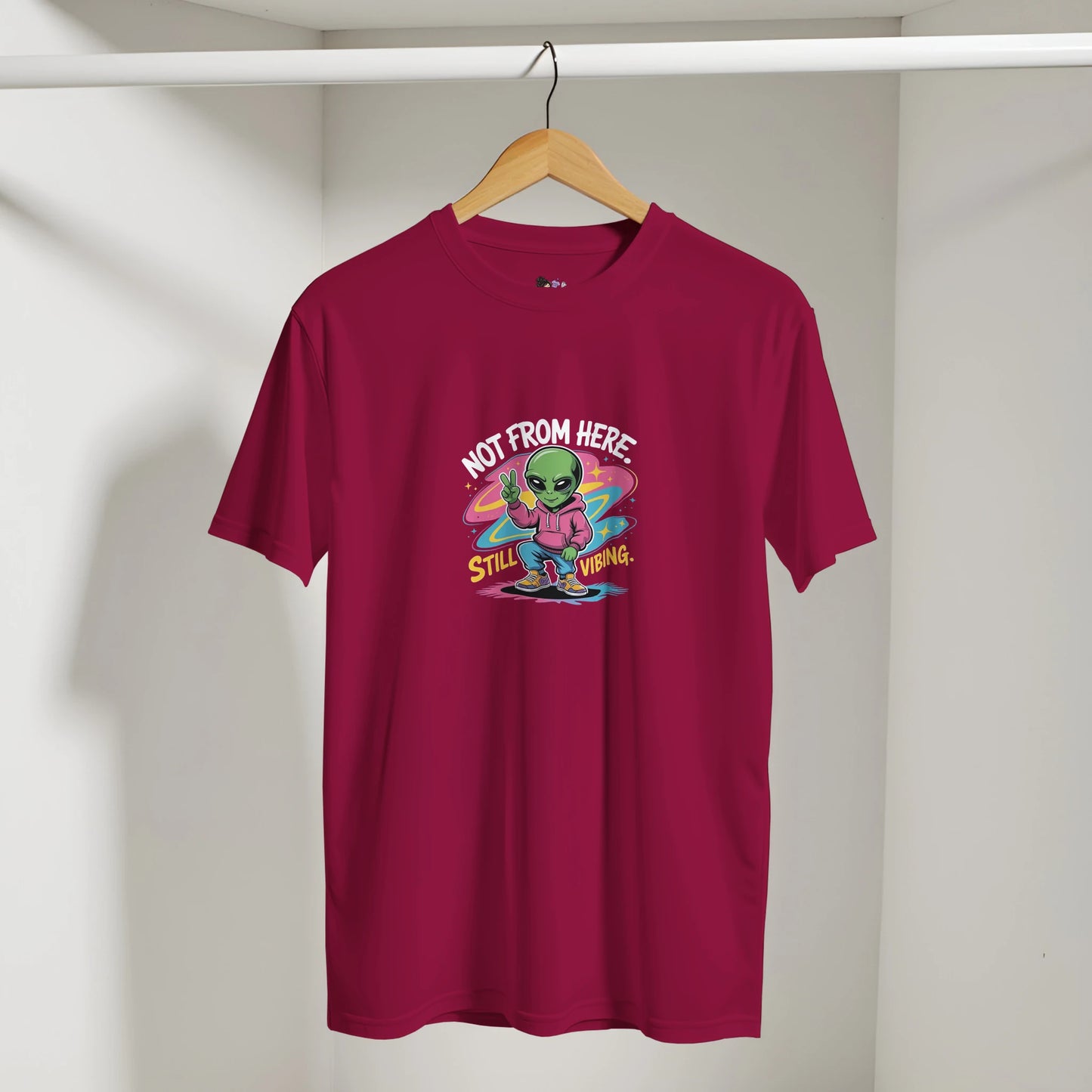 Not From Here Still Vibing graphic tee featuring an alien-themed design on a casual everyday t-shirt.